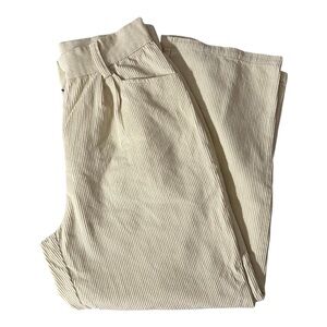 Cream high-waisted corduroy straight leg pants.